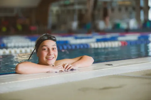 Child in swimming pool at a lesson